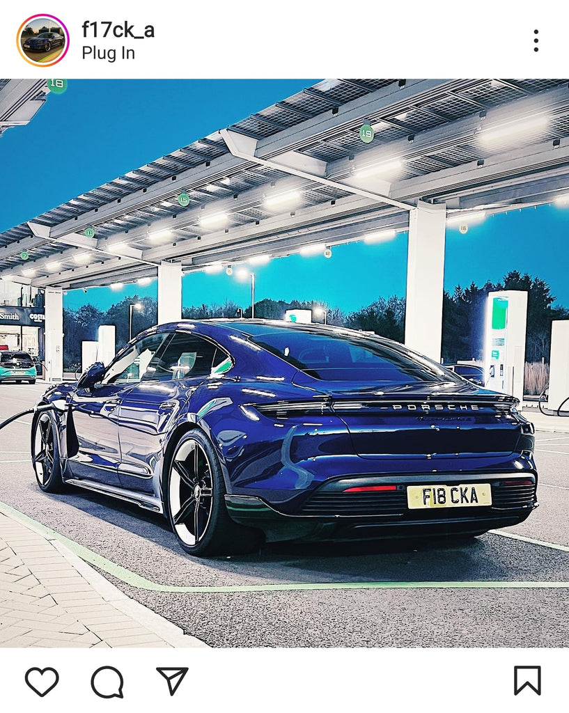 Porsche Taycan with some printed number plates